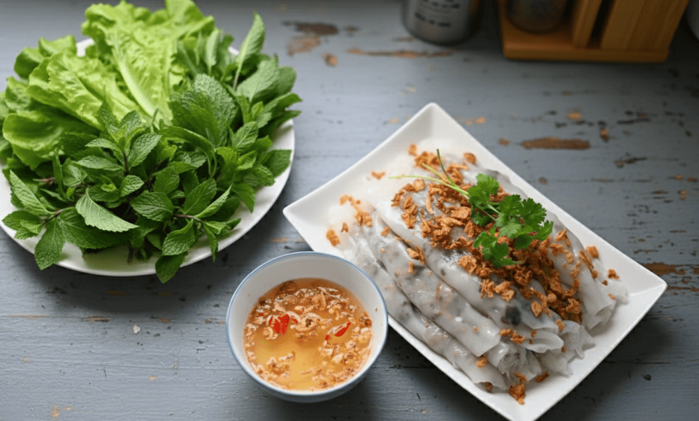 Banh cuon is a delicate dish made from thin sheets of steamed fermented rice batter filled with ground pork and wood ear mushrooms
